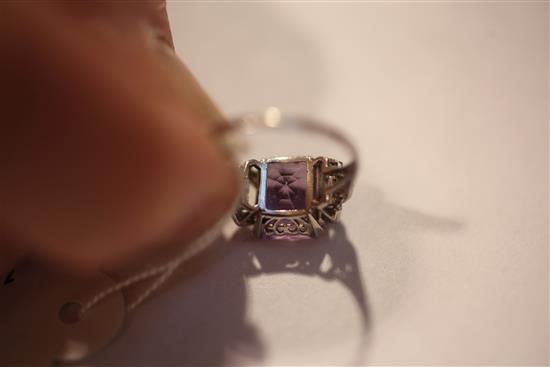 A 1920s/1930s platinum, amethyst and diamond ring, size O.